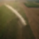 Aerial view of expansive farmland with glyphosate application