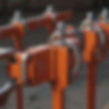 Various types of corral panel clamps arranged for comparison.