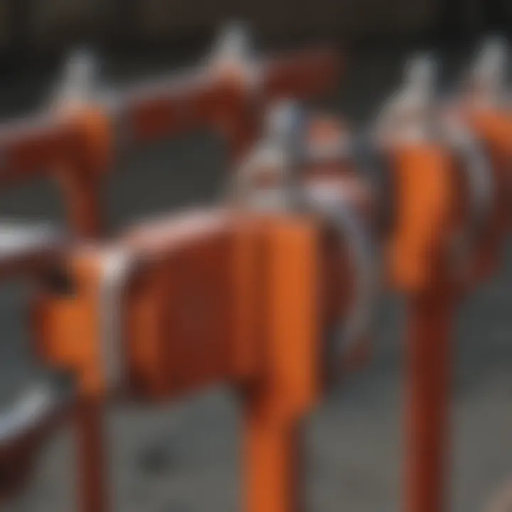 Various types of corral panel clamps arranged for comparison.