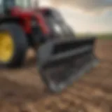 Close-up of a tractor supply rock rake in action on a farmland