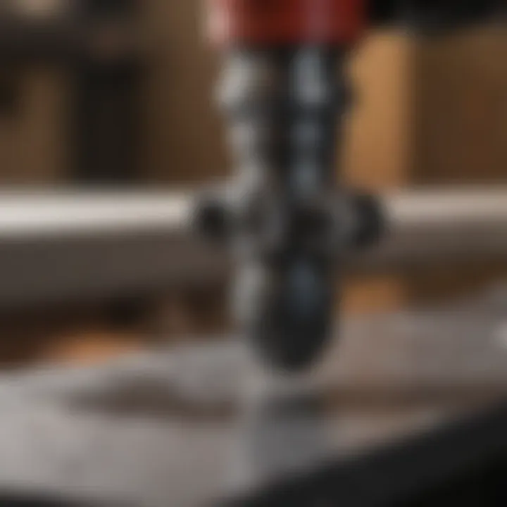 Close-up of a plastic water pipe cutter on a workbench.